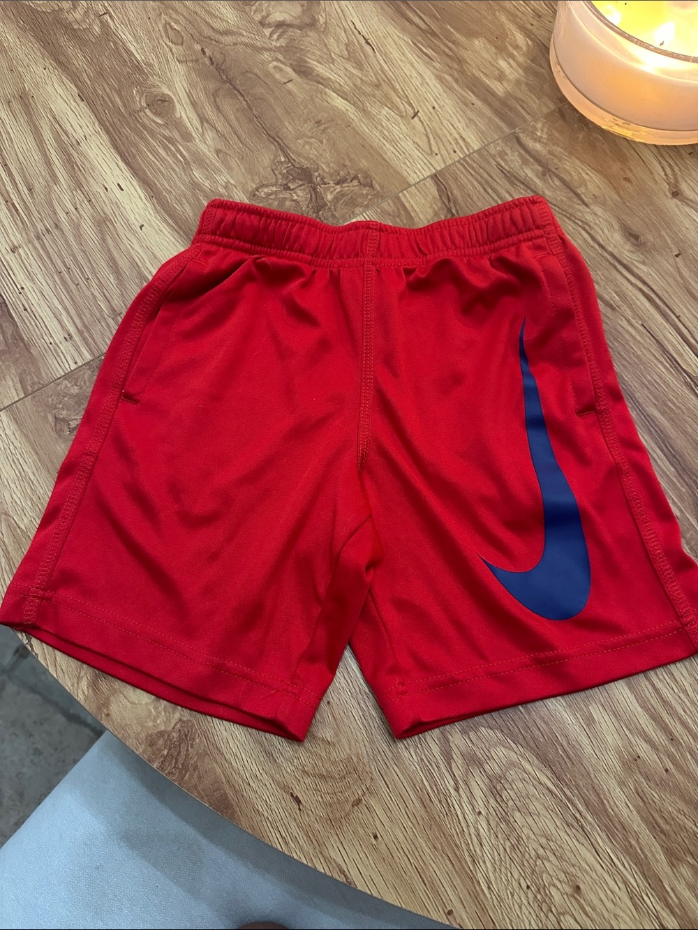 Nike Red Kids Athletic Shorts with Blue Swoosh